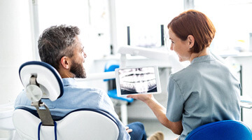 dental professional talking to patient